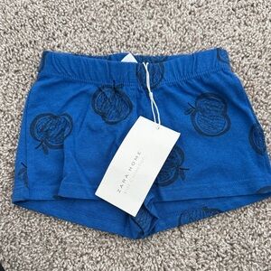 Zara Blue Shorts with Black Apple Design